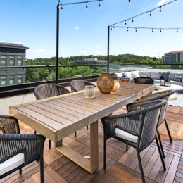 a table and chairs on a deck